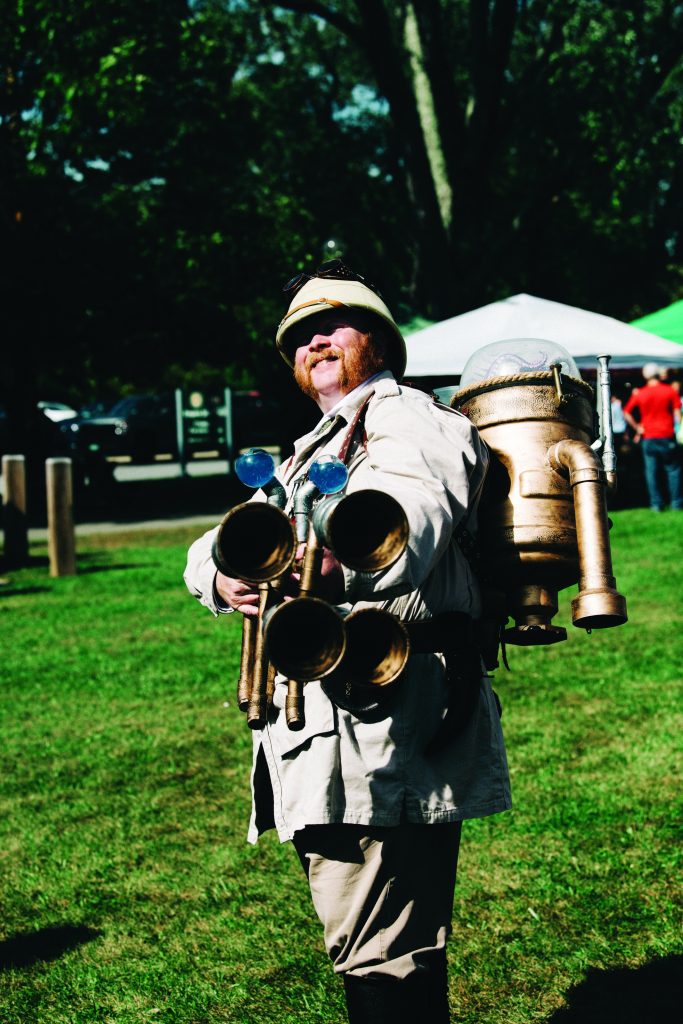 man in Ghostbusters-style costume 