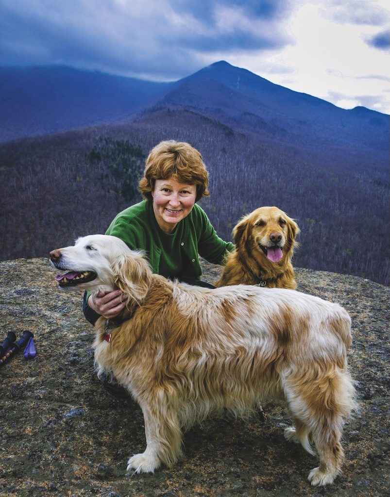 Betsy Folwell and dog friends on Owlshead in Keene NY 2003. photo by Nancie Battaglis